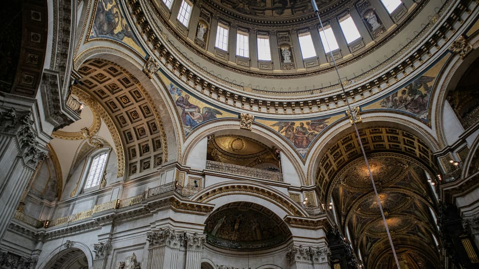 The ornate domed interior of a large church