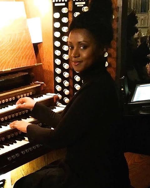 Fiona D. Pacquette playing a pipe organ